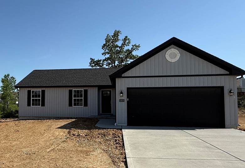 Derek - New house build with tan exterior and dark brown trim