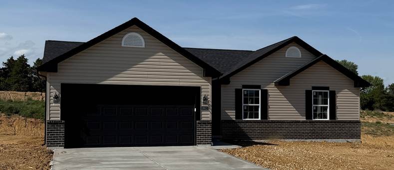The Lauren II - New house build with tan exterior and dark brown trim